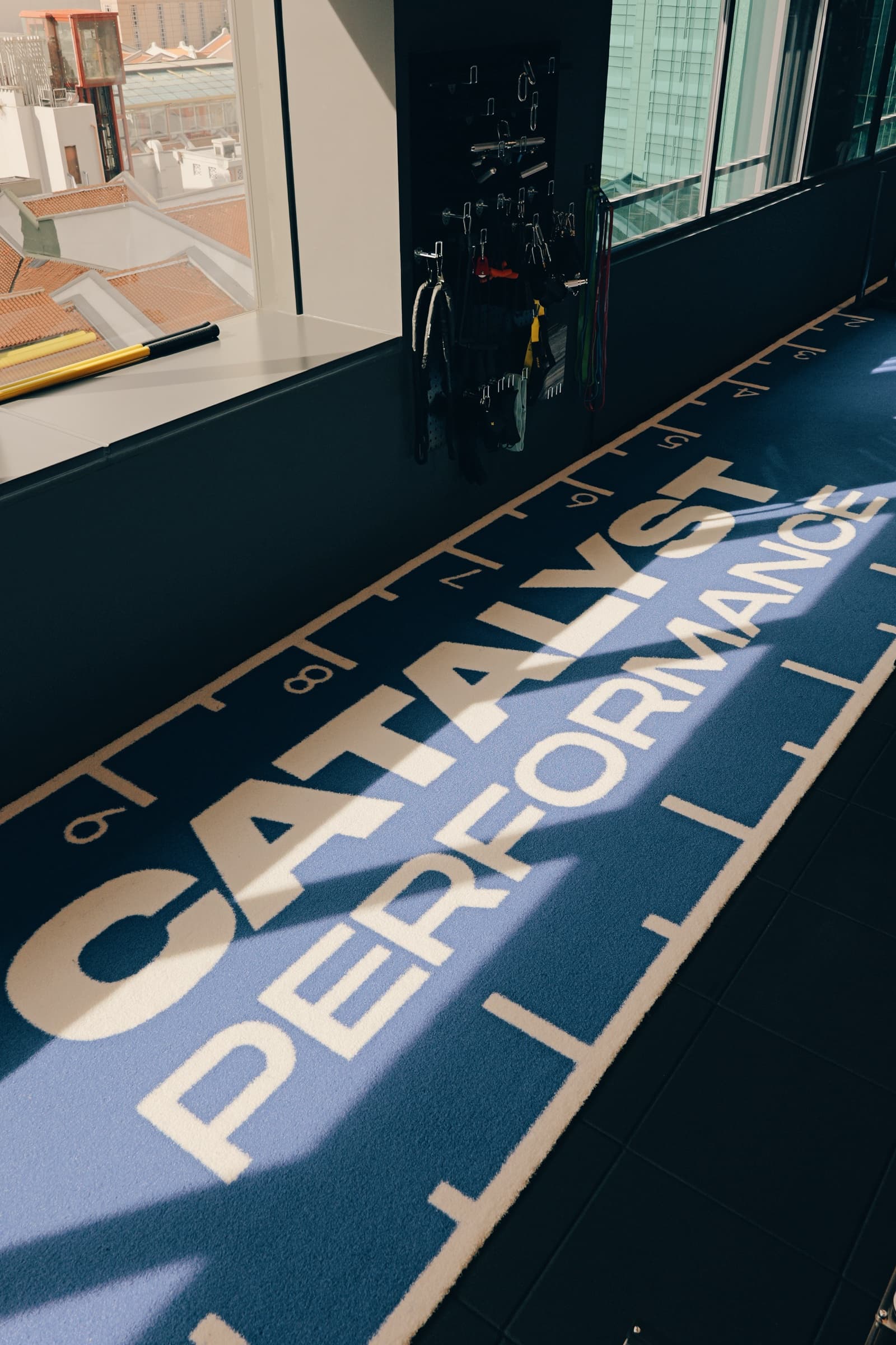 Catalyst Performance branded training floor with city view, Manulife Tower Singapore