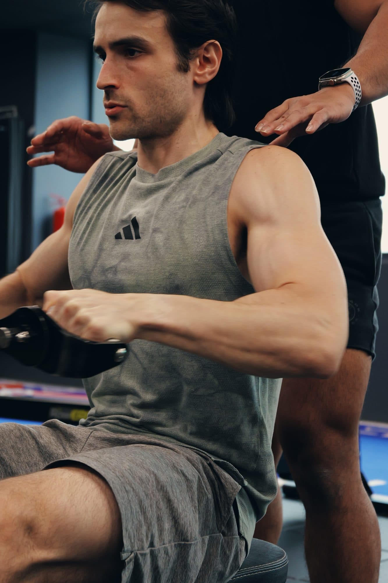 A client training 1:1 on a cable machine under coaching at Catalyst Performance, Singapore CBD