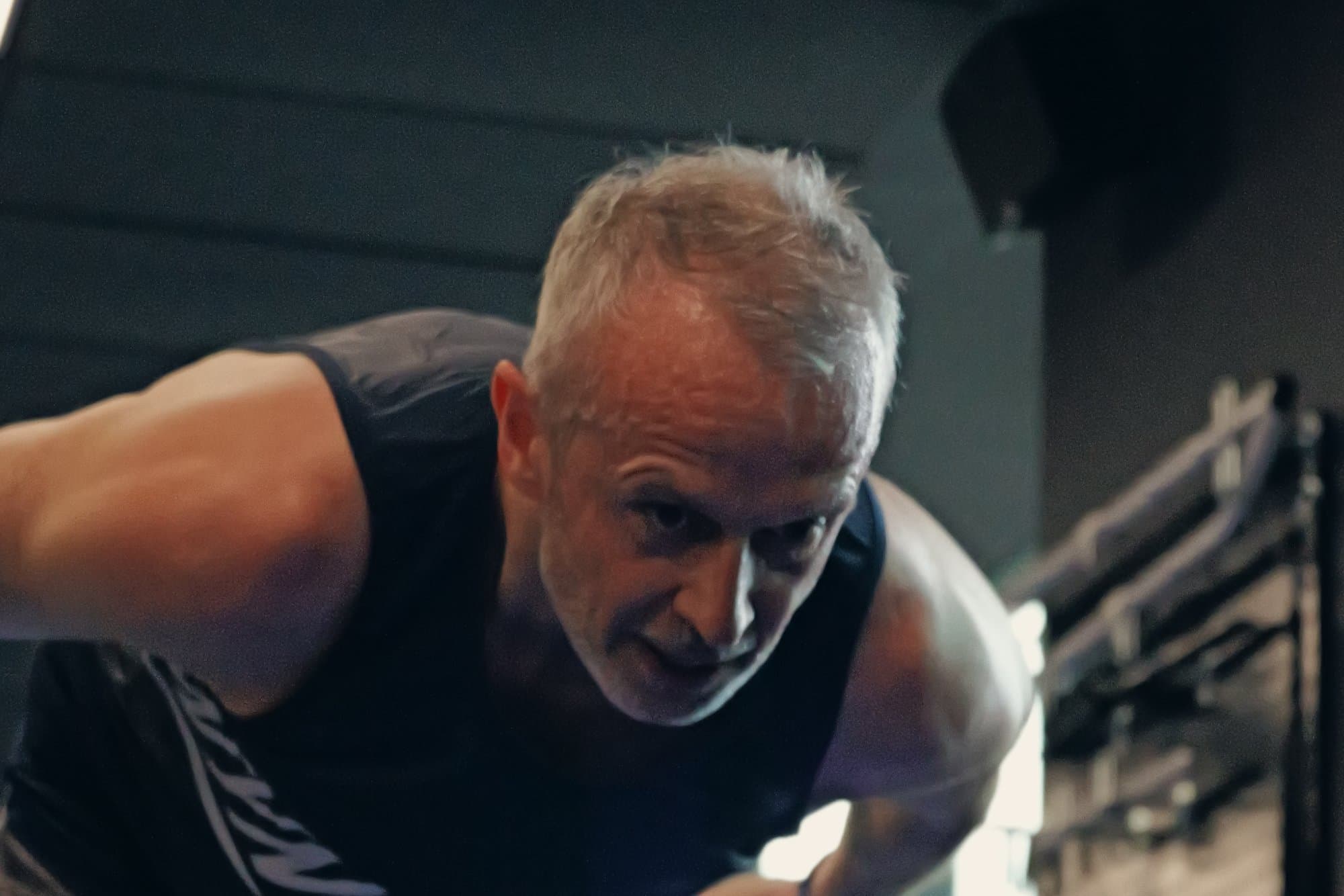 An older male member training strength in the Catalyst Performance studio, Singapore CBD personal training