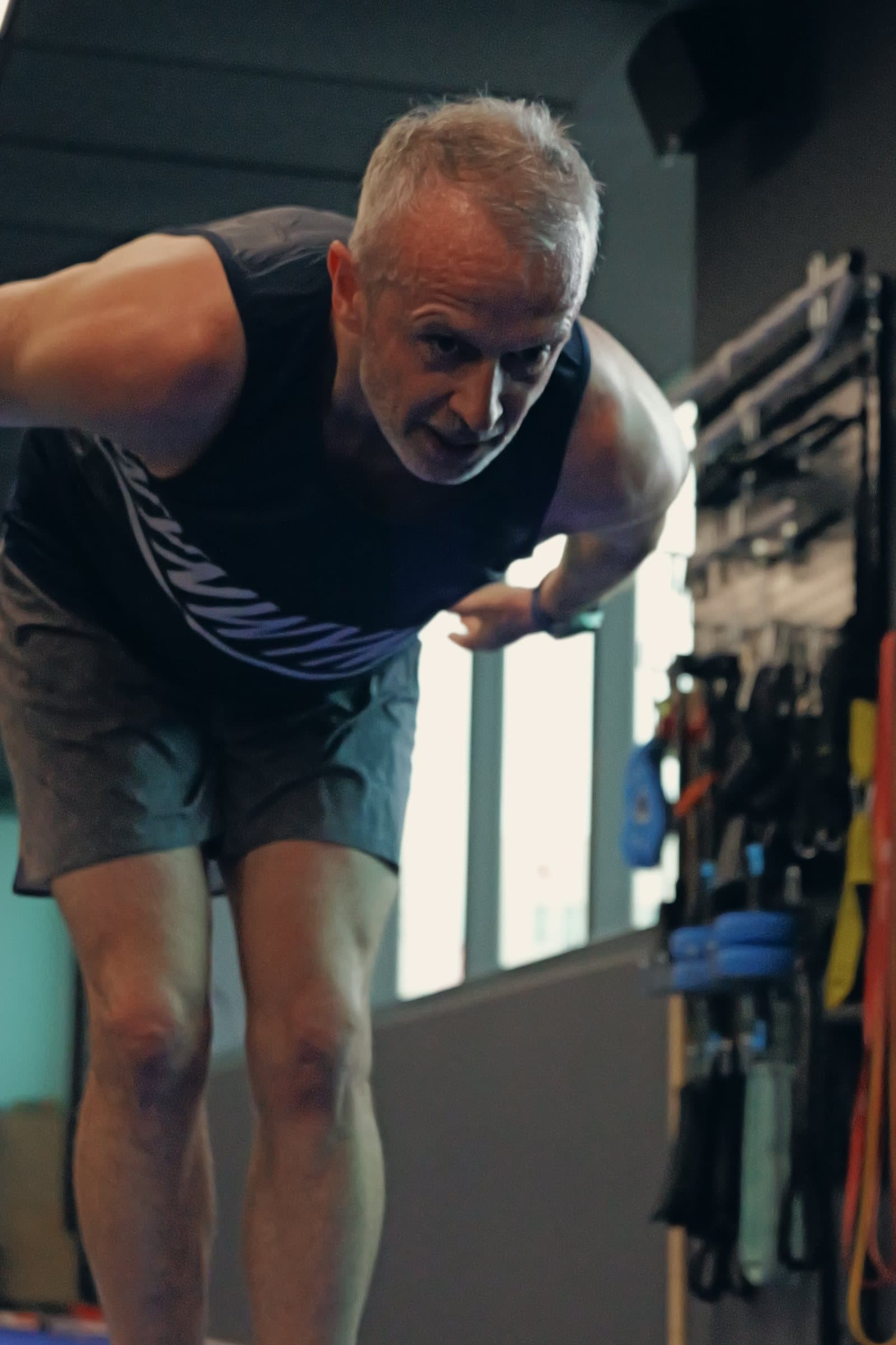 A client over 50 training one-to-one at Catalyst Performance, Manulife Tower in Singapore CBD