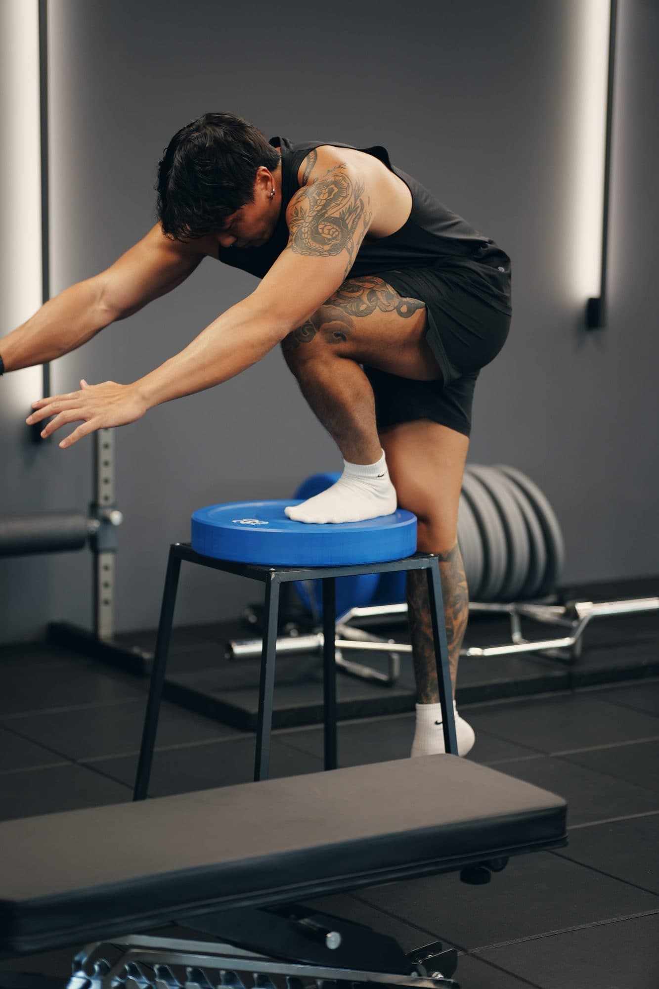 Foot planted on a plyo box, single-leg control work at Catalyst Performance