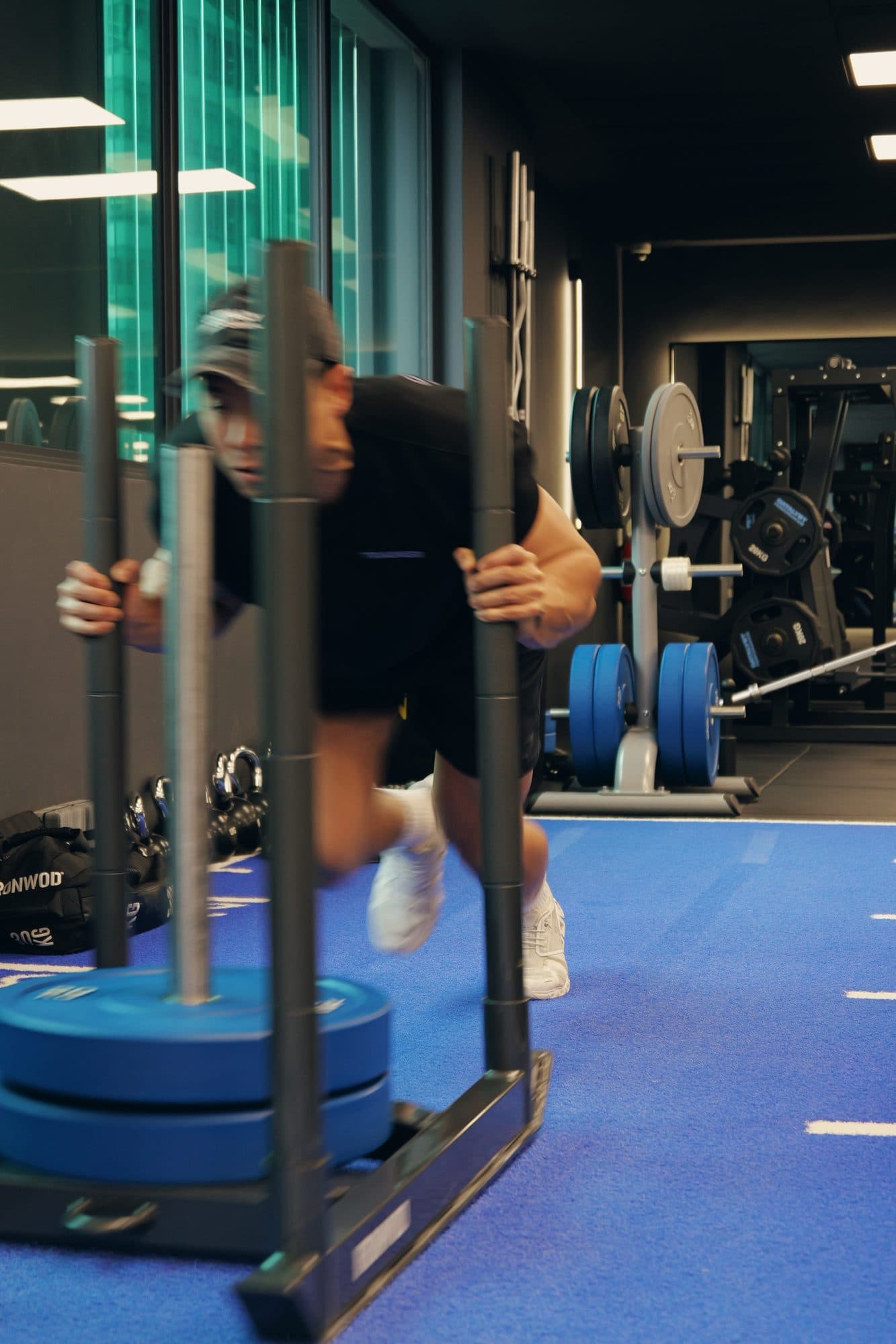Sled push down the Catalyst Performance turf track, Singapore CBD